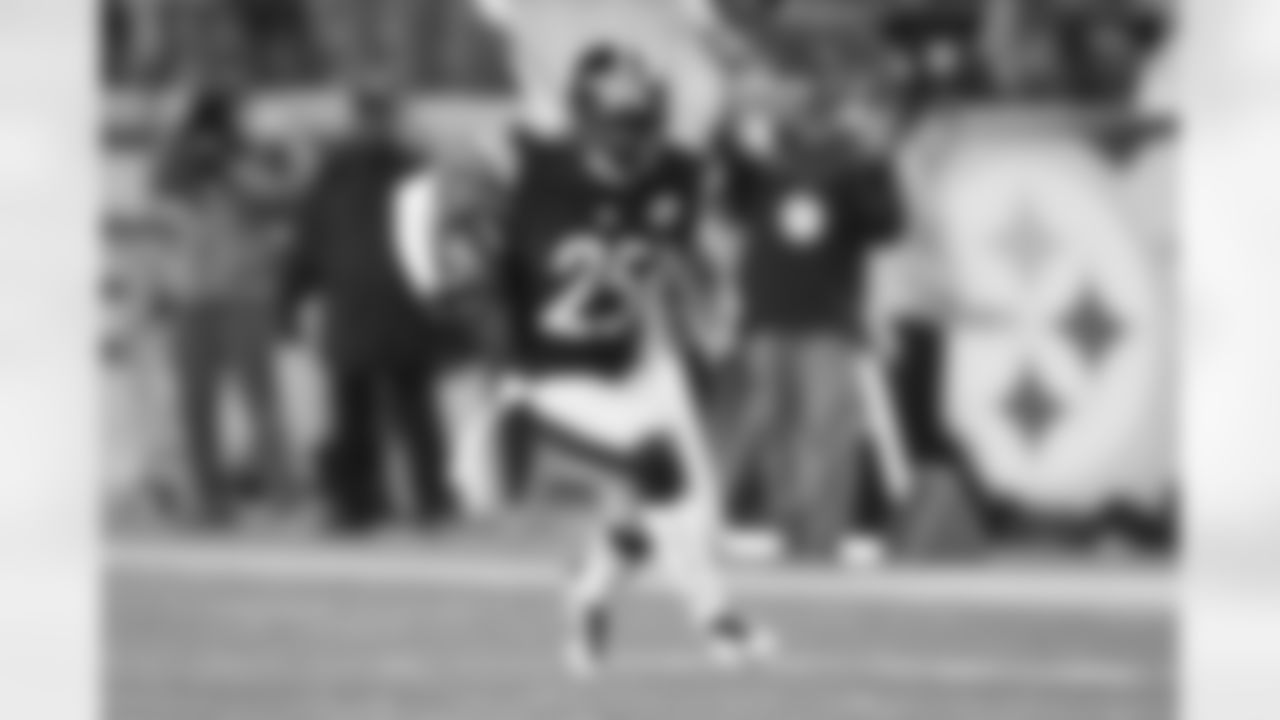 Brice McCain intercepts a pass by Andy Dalton. McCain finished the game with two interceptions.