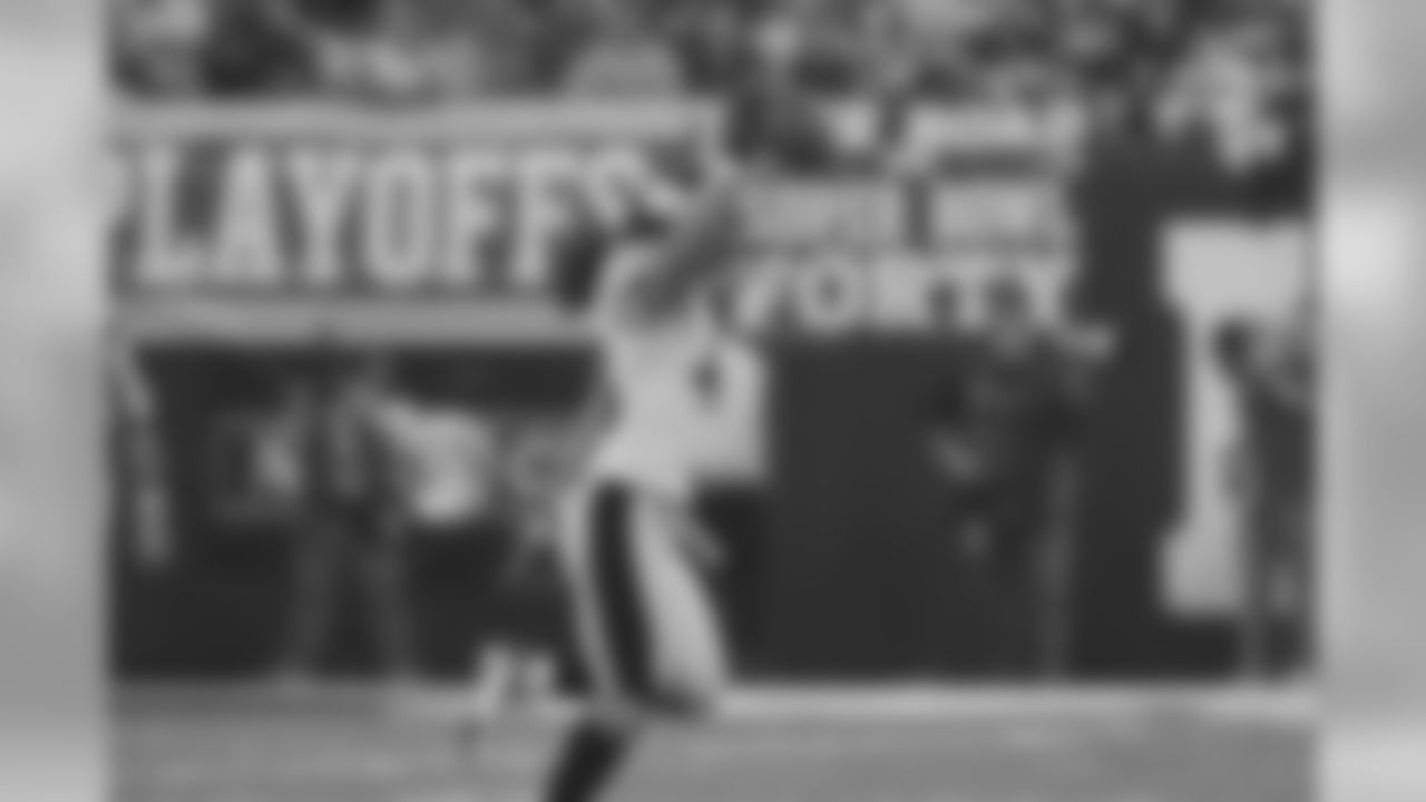 Action photograph of strong safety Troy Polamalu celebrating after intercepting Peyton Manning during the AFC Divisional Playoff game between the Pittsburgh Steelers and the Indianapolis Colts, where the Steelers defeated the Colts 21-18. The call would later be overturned.