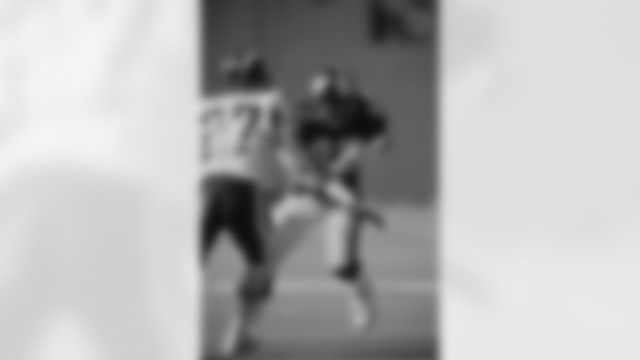 Action photograph of wide receiver Louis Lipps #83 during his time with the Steelers.
