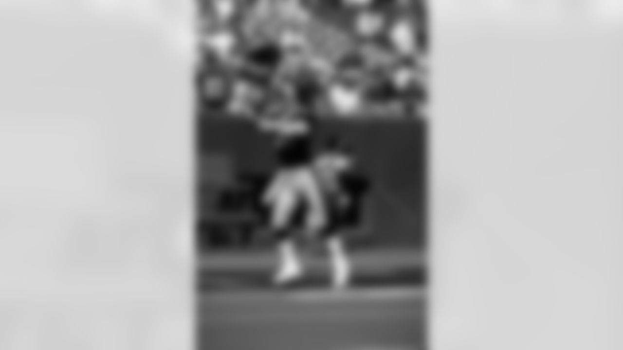Action photograph of wide receiver Louis Lipps #83 during his time with the Steelers.