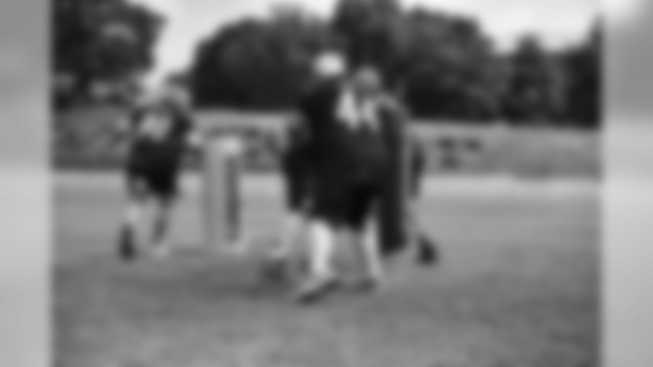 Steelers fans take part in on-field drills during Men's Fantasy Camp.