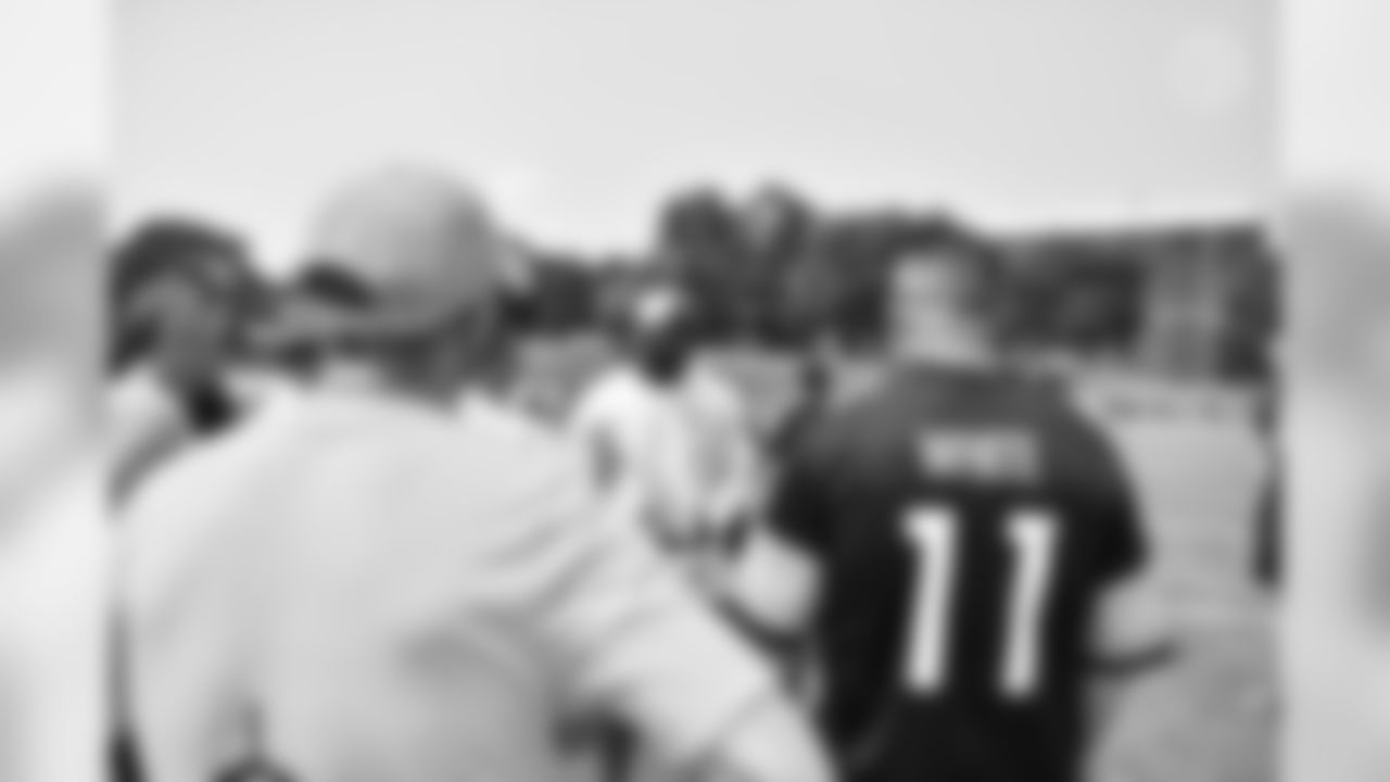 Steelers fans take part in on-field drills during Men's Fantasy Camp.