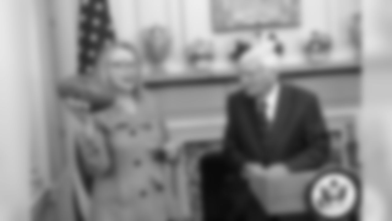 Dan Rooney stands with Secretary of State Hillary Clinton during a flag ceremony in 2013.