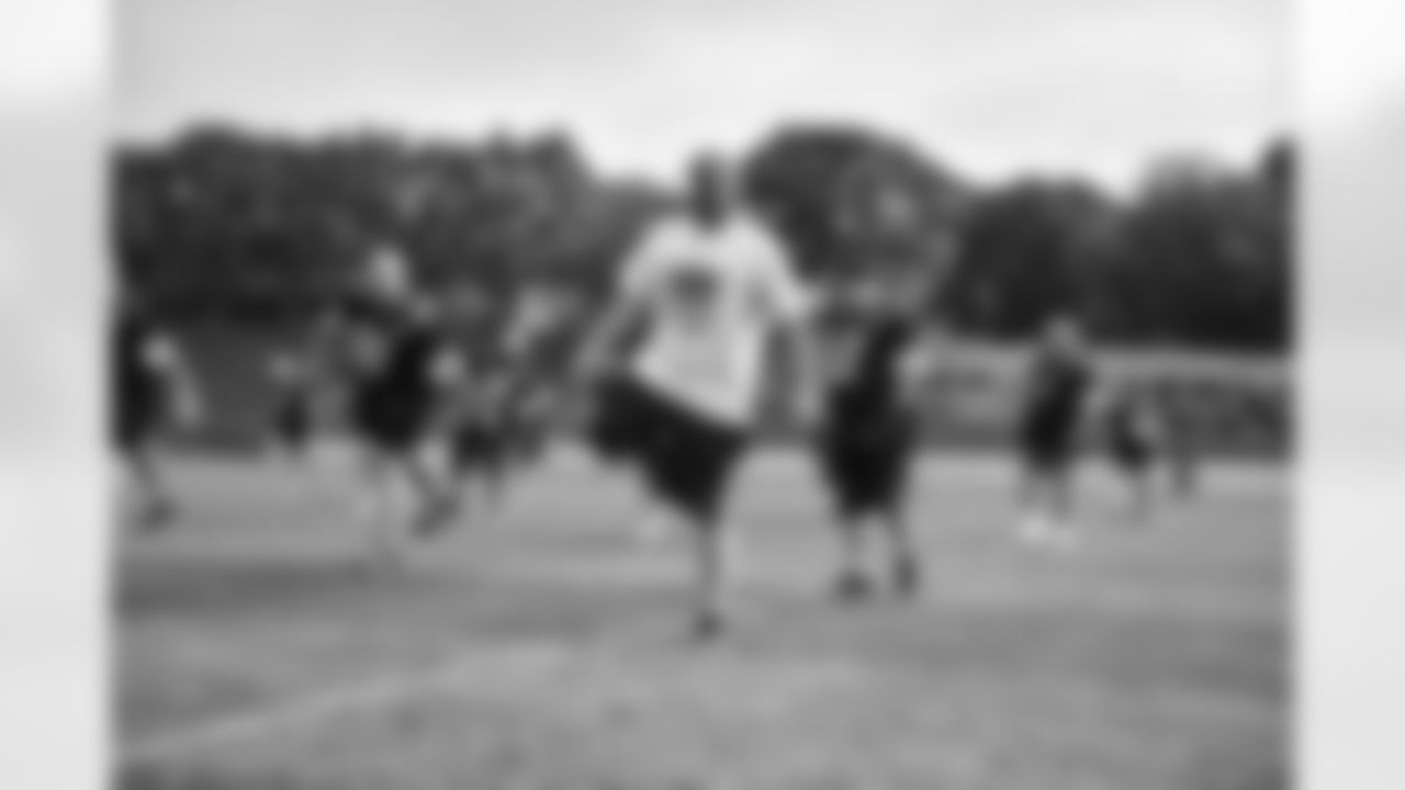 Steelers fans take part in on-field drills during Men's Fantasy Camp.