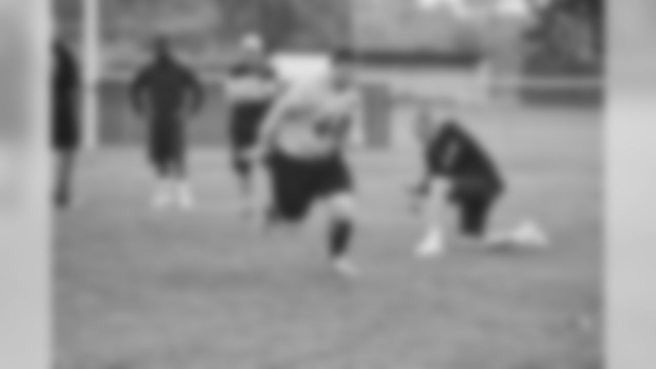 Steelers fans take part in on-field drills during Men's Fantasy Camp.
