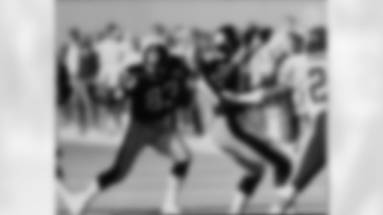 Action photograph of wide receiver Louis Lipps #83 during his time with the Steelers.