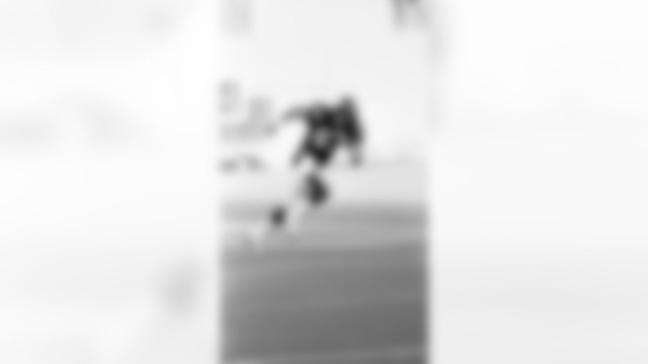Action photograph of wide receiver Louis Lipps #83 during his time with the Steelers.