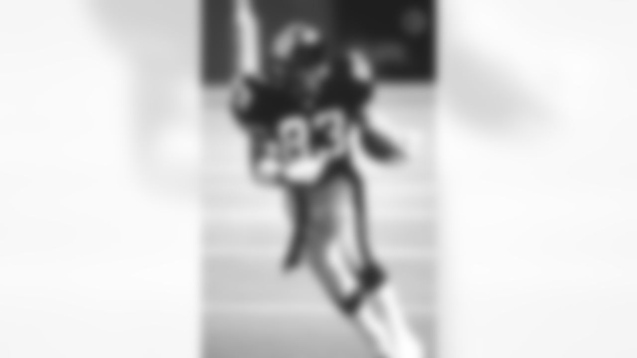 Action photograph of wide receiver Louis Lipps #83 during his time with the Steelers.