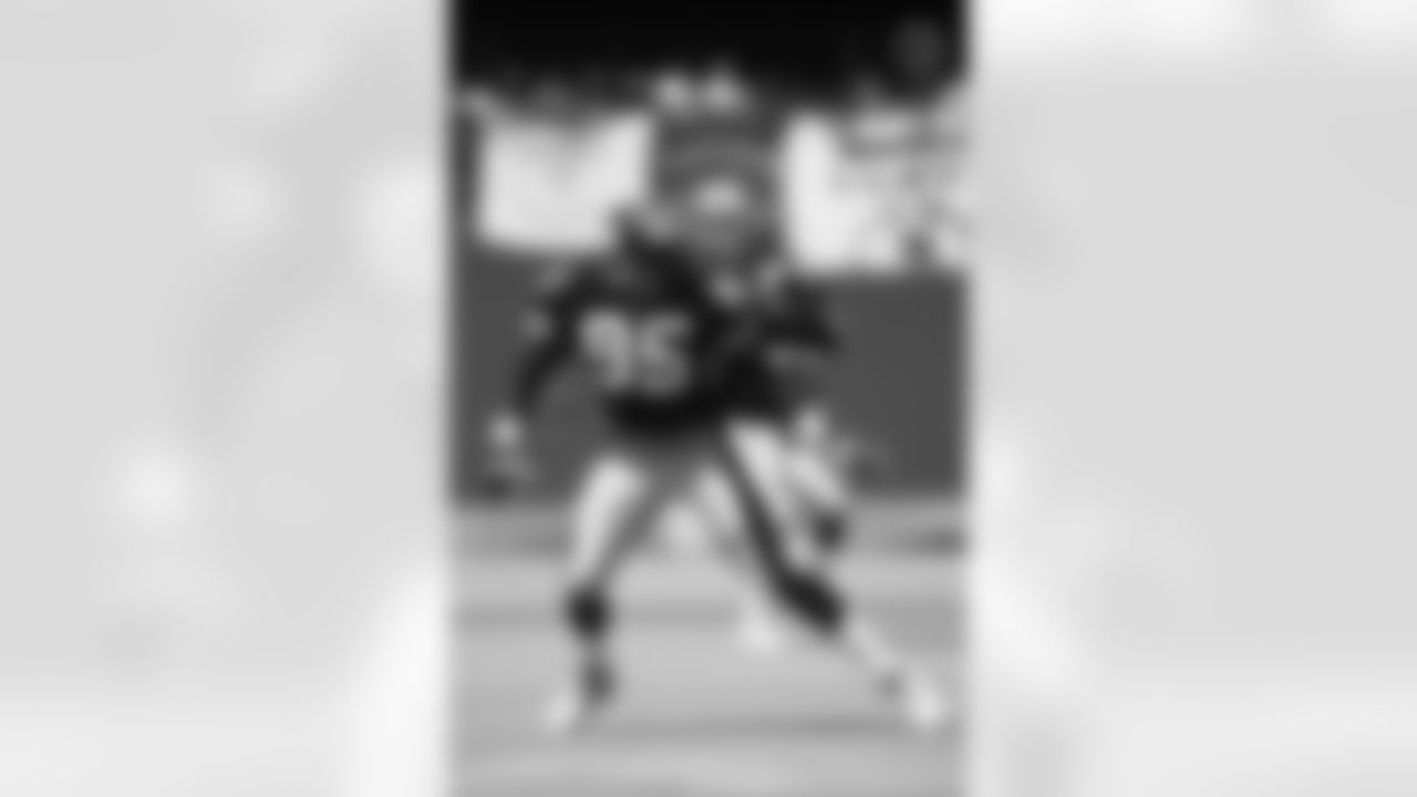 Action shot of linebacker Greg Lloyd #95 during his time with the Pittsburgh Steelers.