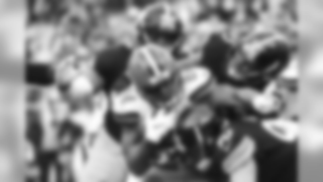 Tyson Alualu, Devin Bush and T.J. Watt