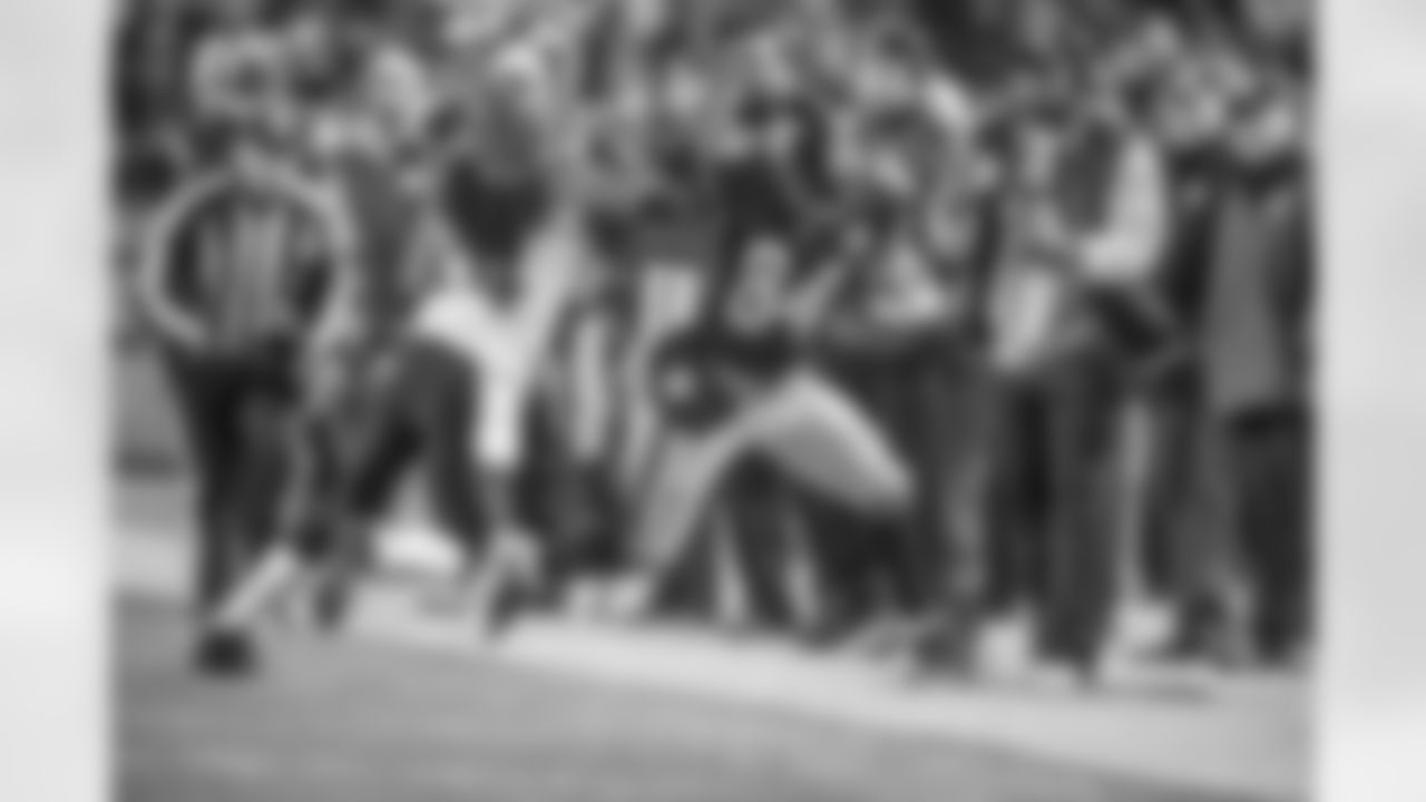 Anotnio Brown gets the first down as he is pushed out of bounds by a Cincinatti defender.