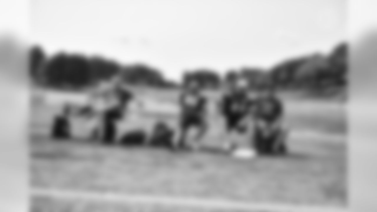 Steelers fans take part in on-field drills during Men's Fantasy Camp.