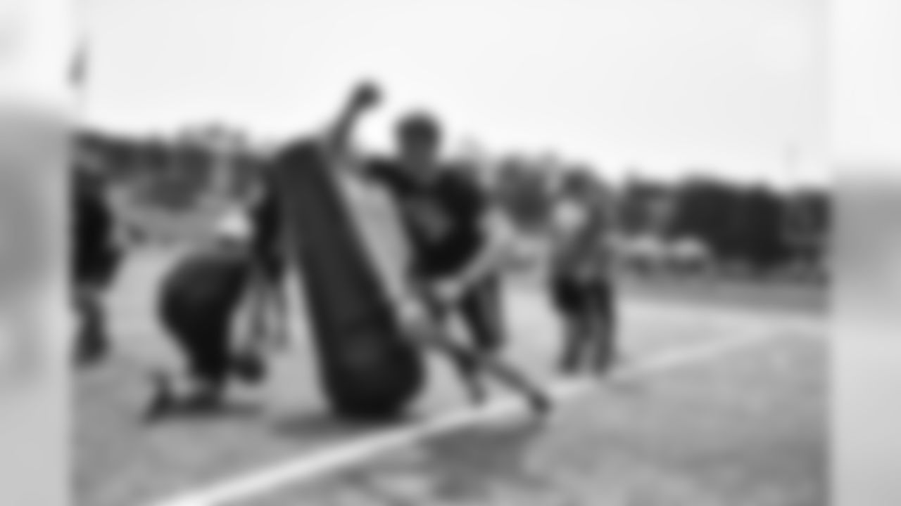 Steelers fans take part in on-field drills during Men's Fantasy Camp.