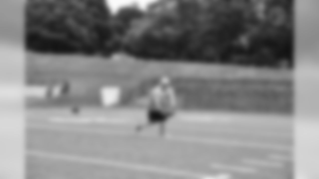 Steelers fans take part in on-field drills during Men's Fantasy Camp.