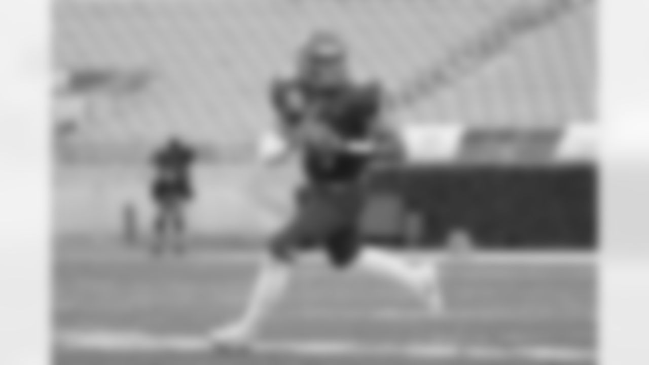 National Team quarterback Chris Oladokun runs during the first half of the NFLPA Collegiate Bowl college football game against the American Team Saturday, Jan. 29, 2022, in Pasadena, Calif. (AP Photo/Marcio Jose Sanchez)