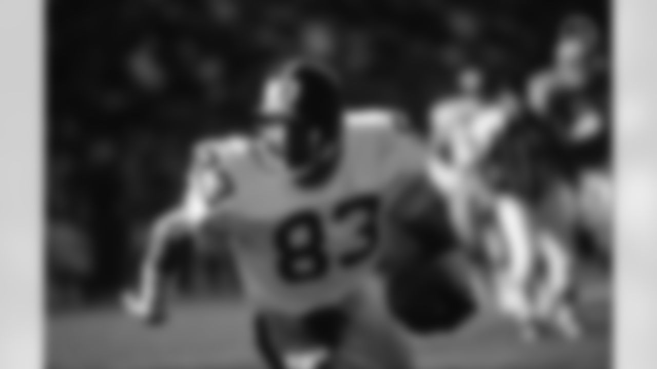 Action photograph of wide receiver Louis Lipps #83 during his time with the Steelers.