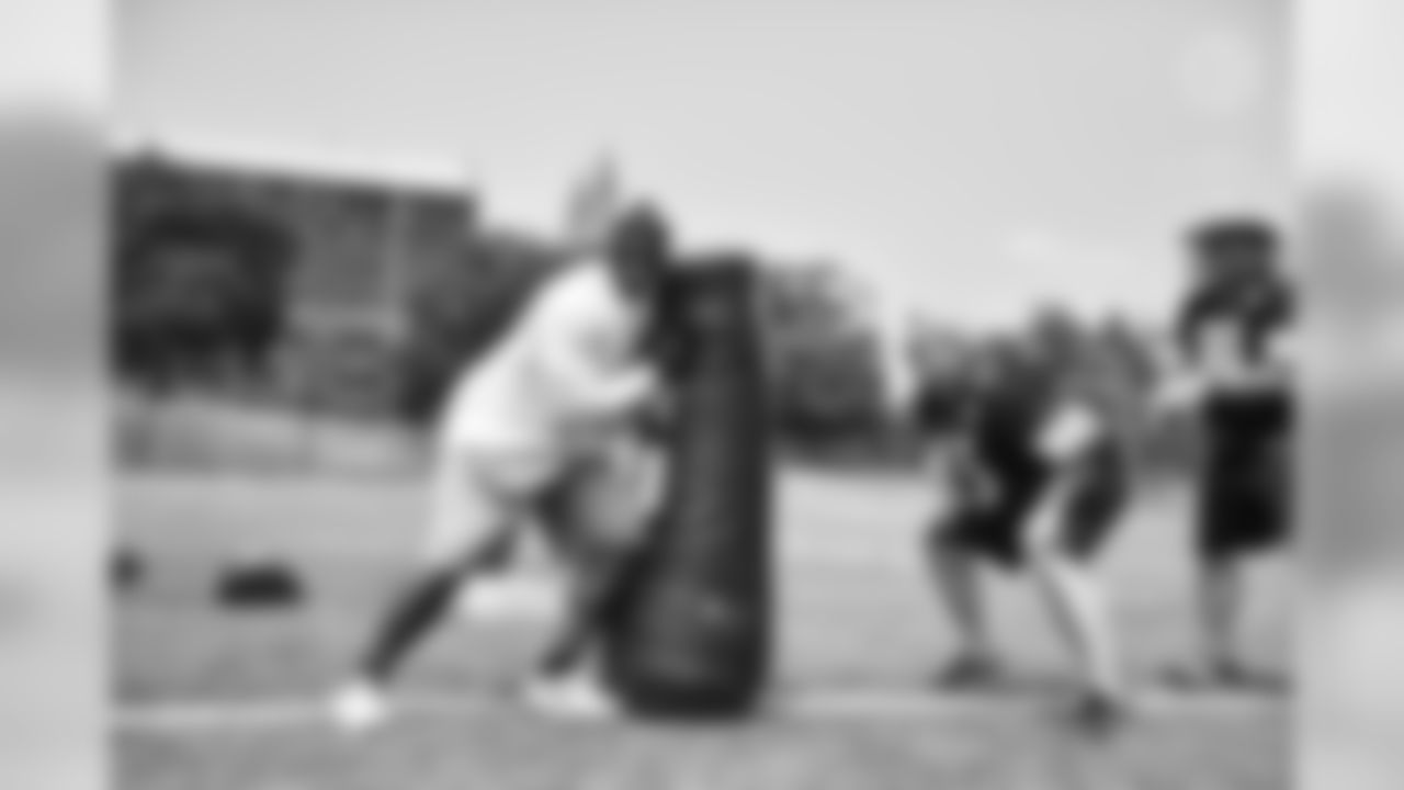Steelers fans take part in on-field drills during Men's Fantasy Camp.