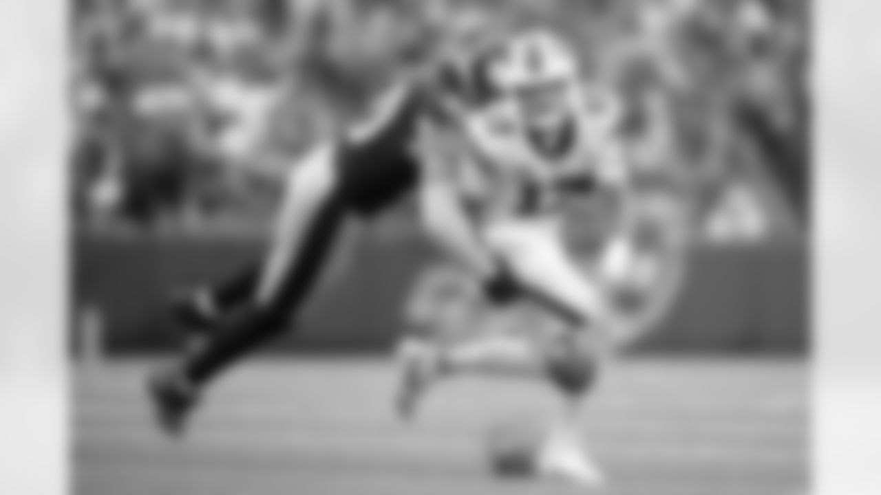 Pittsburgh Steelers linebacker T.J. Watt (90) strips the ball from Buffalo Bills quarterback Josh Allen (17) causing a turnover. I love the clean background and how the players are isolated from everyone else on the field as T.J. punches the ball loose. (Karl Roser / Pittsburgh Steelers)