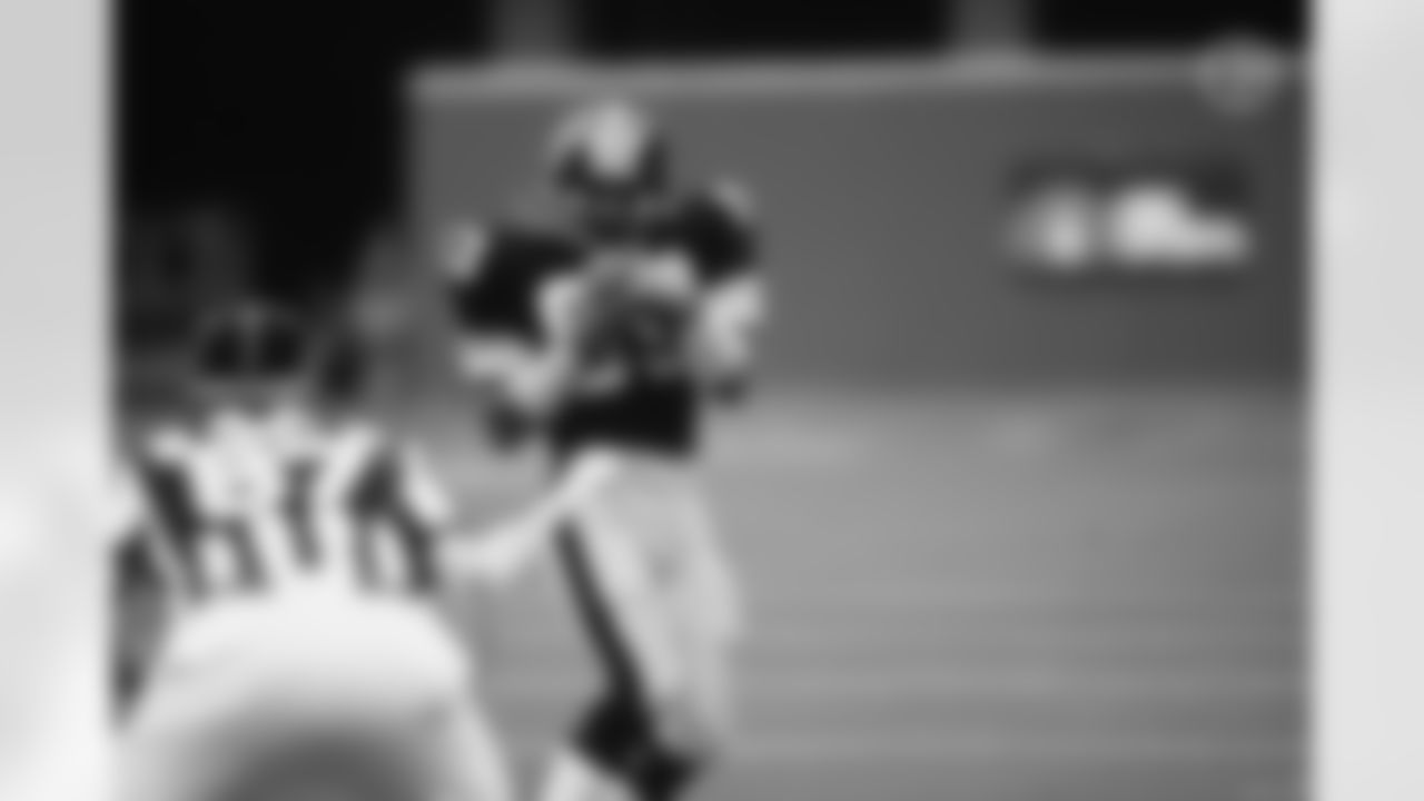Action photograph of wide receiver Louis Lipps #83 during his time with the Steelers.