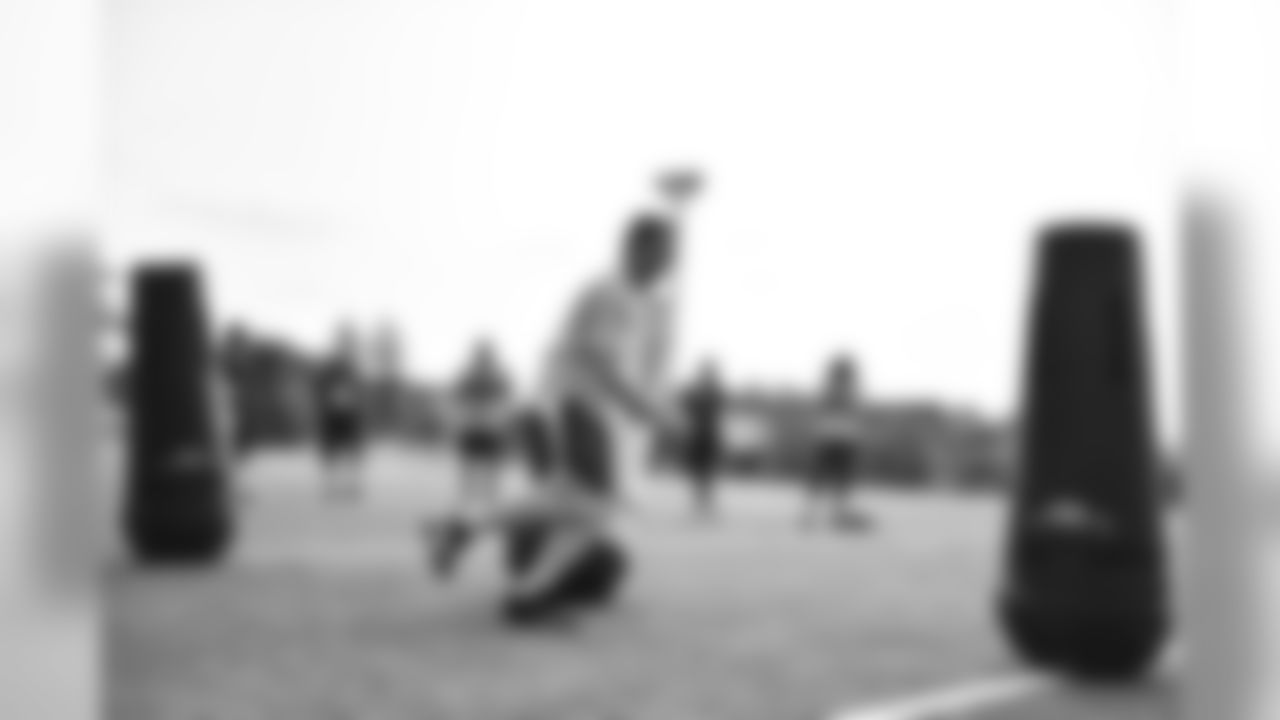 Steelers fans take part in on-field drills during Men's Fantasy Camp.
