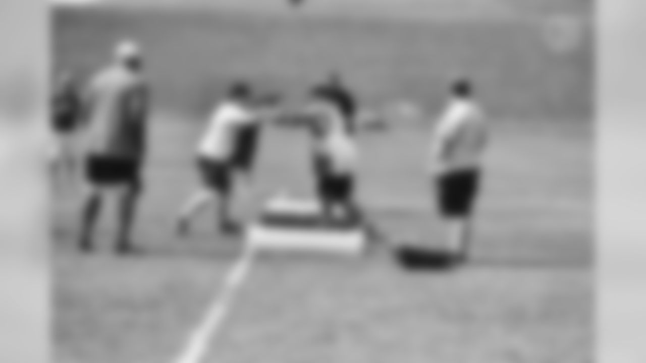Steelers fans take part in on-field drills during Men's Fantasy Camp.