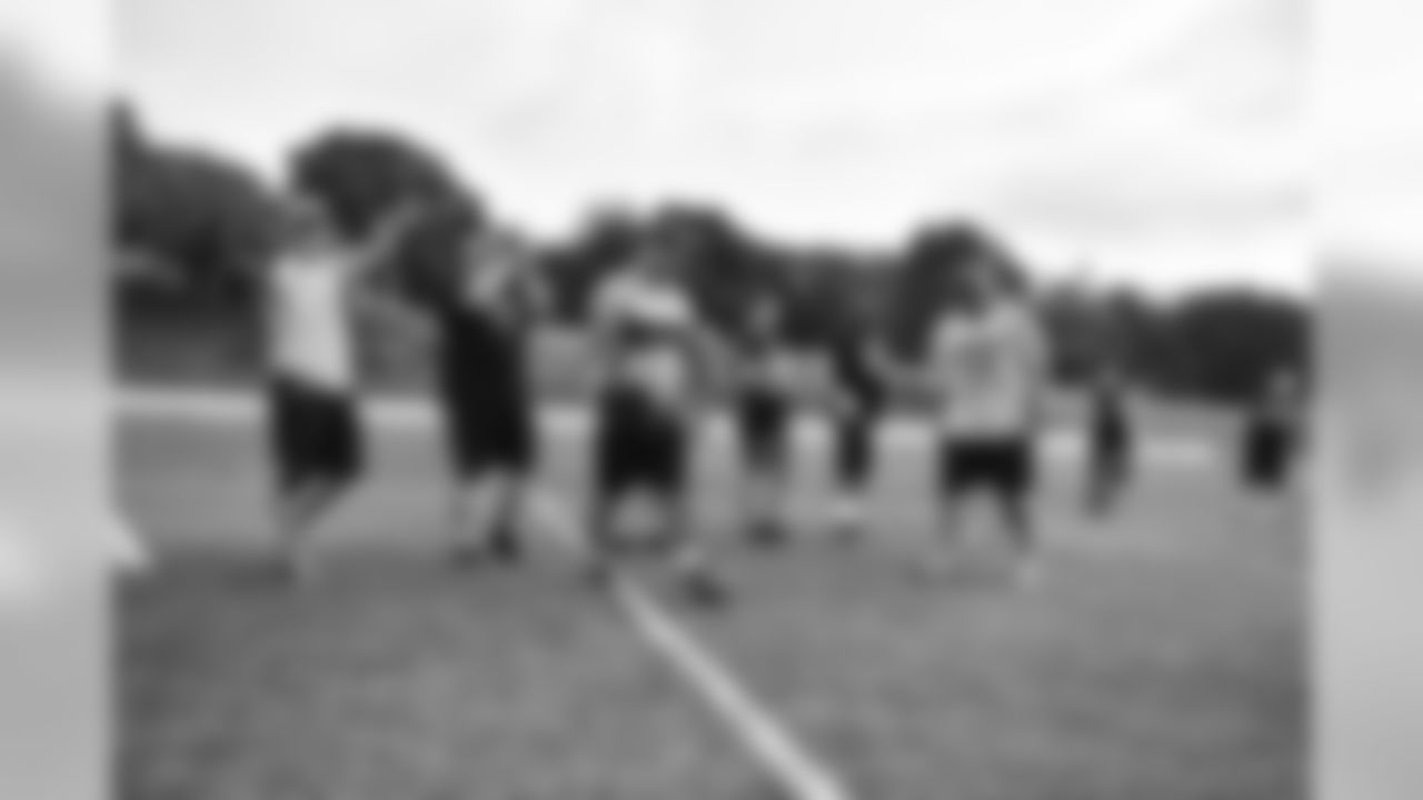 Steelers fans take part in on-field drills during Men's Fantasy Camp.