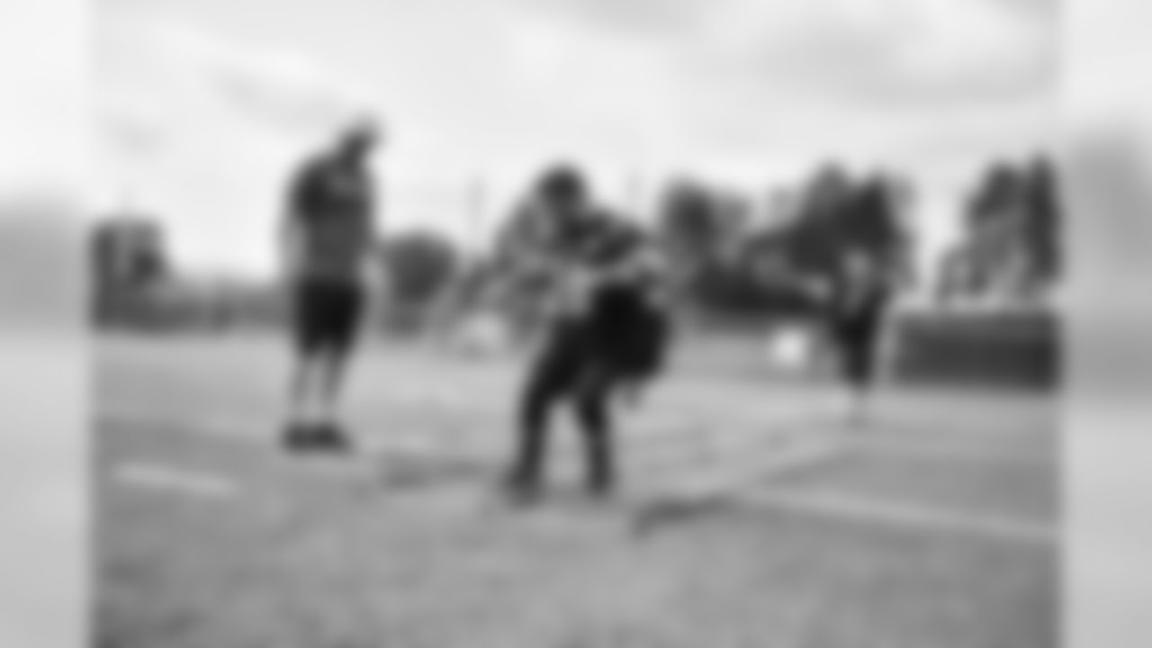 Steelers fans take part in on-field drills during Men's Fantasy Camp.