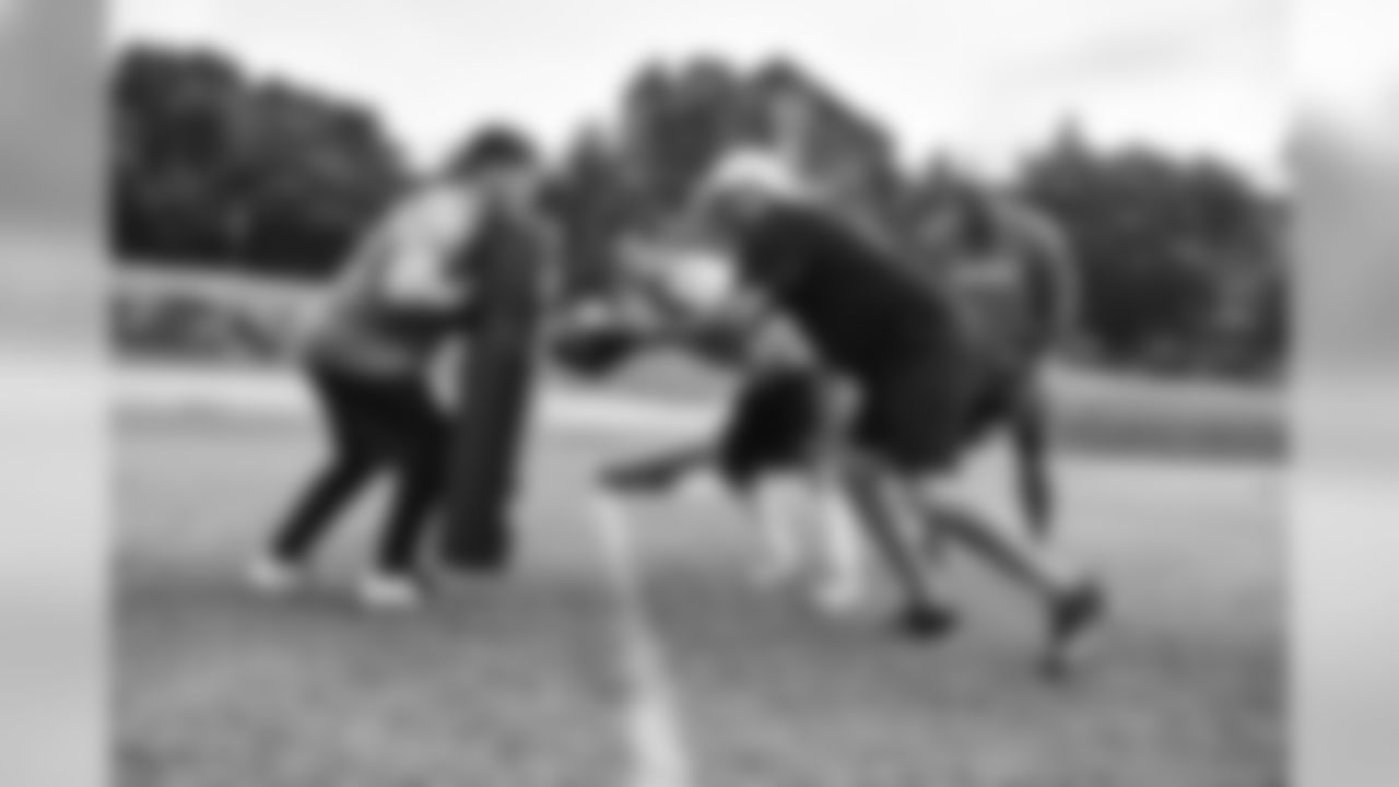 Steelers fans take part in on-field drills during Men's Fantasy Camp.
