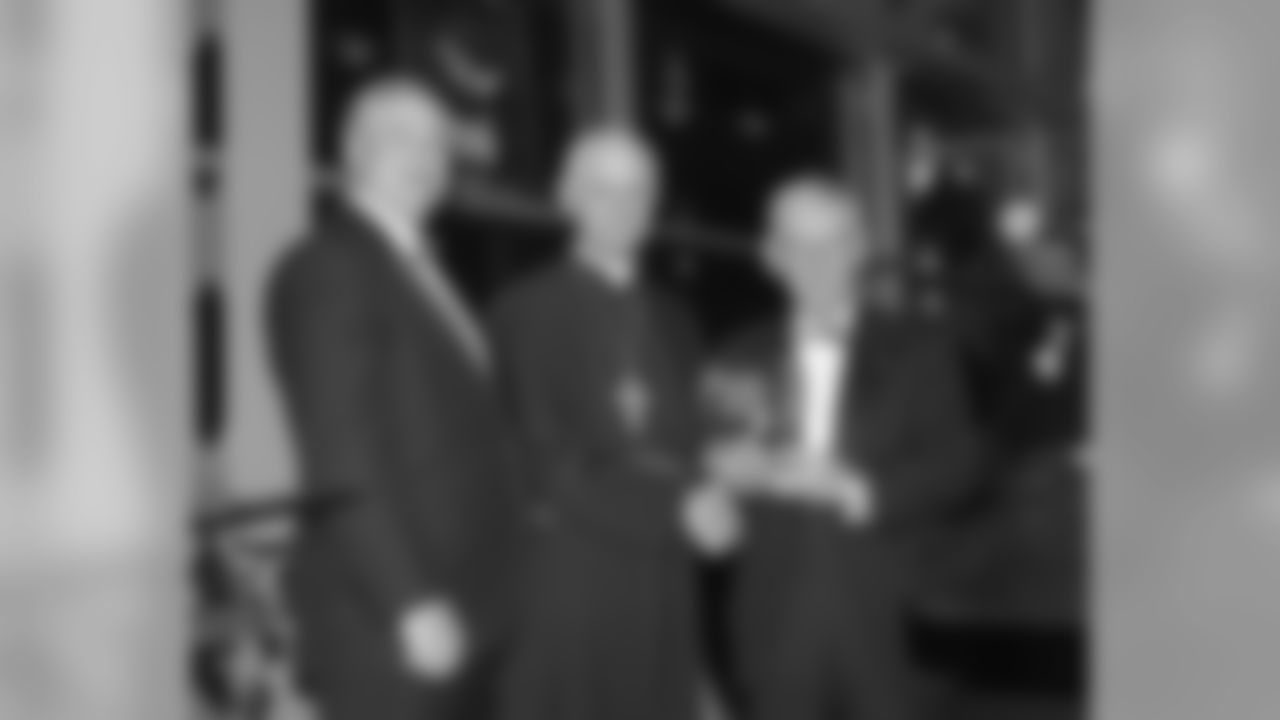 Dan Rooney along with James Rohr present Cardinal Wuerl with the American Ireland Fund honor.