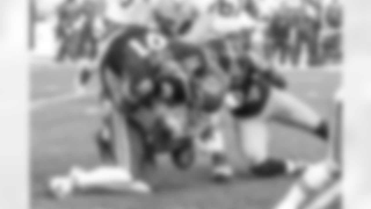 Stephon Tuitt and Lawrence Timmons force a Kansas City fumble.