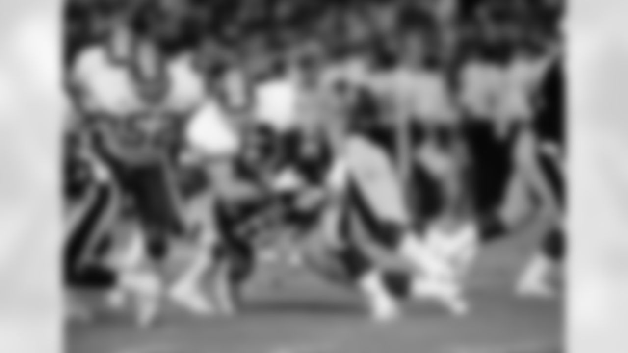 Dean Hamel (78), Washington Redskins, tackles running back Merril Hoge (33) Pittsburgh Steelers in the first quarter of pre-season action at RFK Stadium, Aug. 5, 1988. (AP Photo/Ron Edmonds)