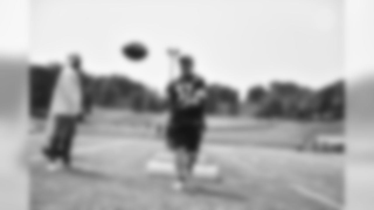 Steelers fans take part in on-field drills during Men's Fantasy Camp.