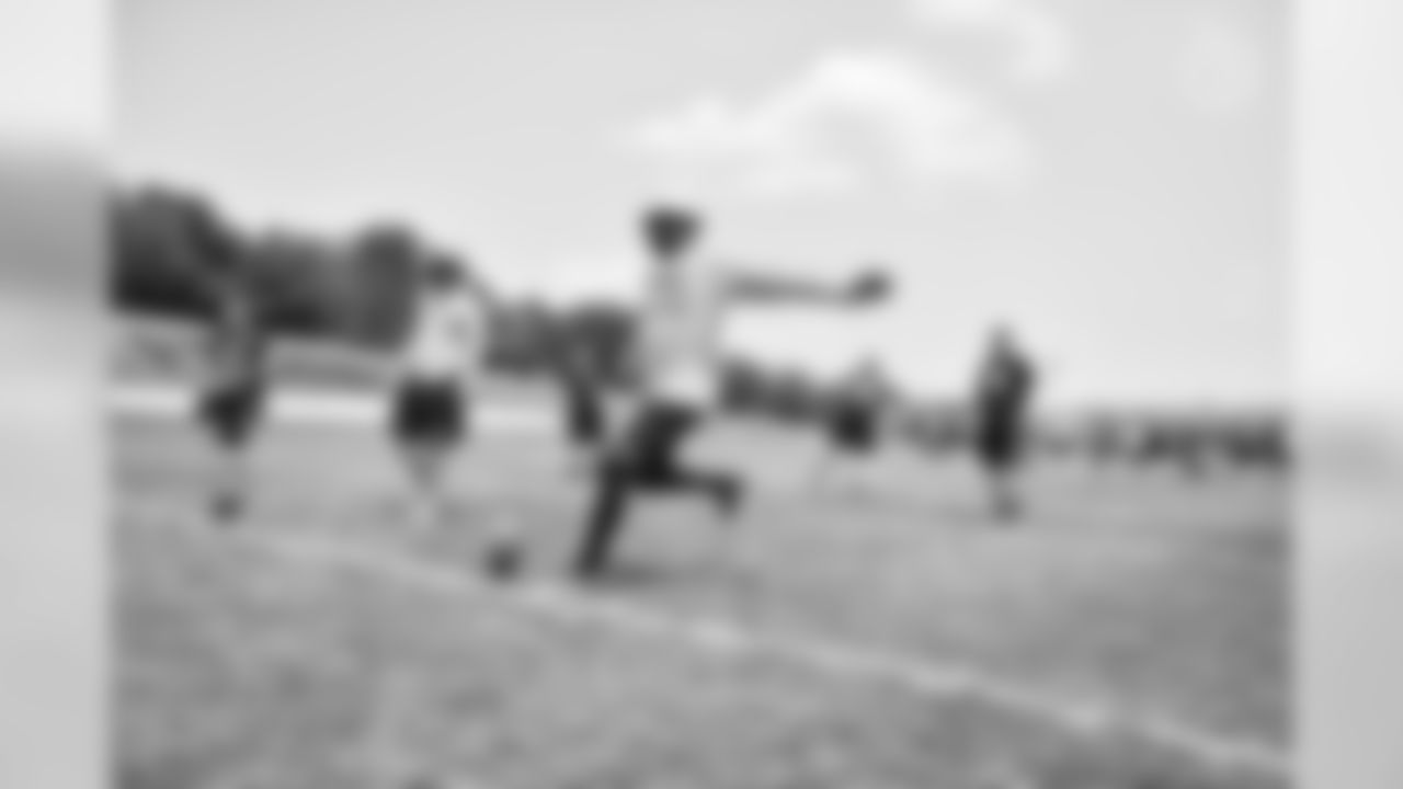 Steelers fans take part in on-field drills during Men's Fantasy Camp.