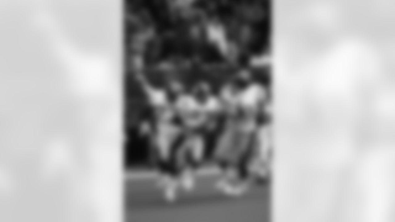 Action photograph of wide receiver Louis Lipps #83 during his time with the Steelers.