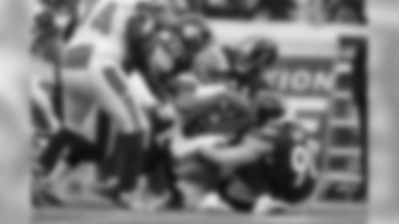 Tyson Alualu, Devin Bush and T.J. Watt