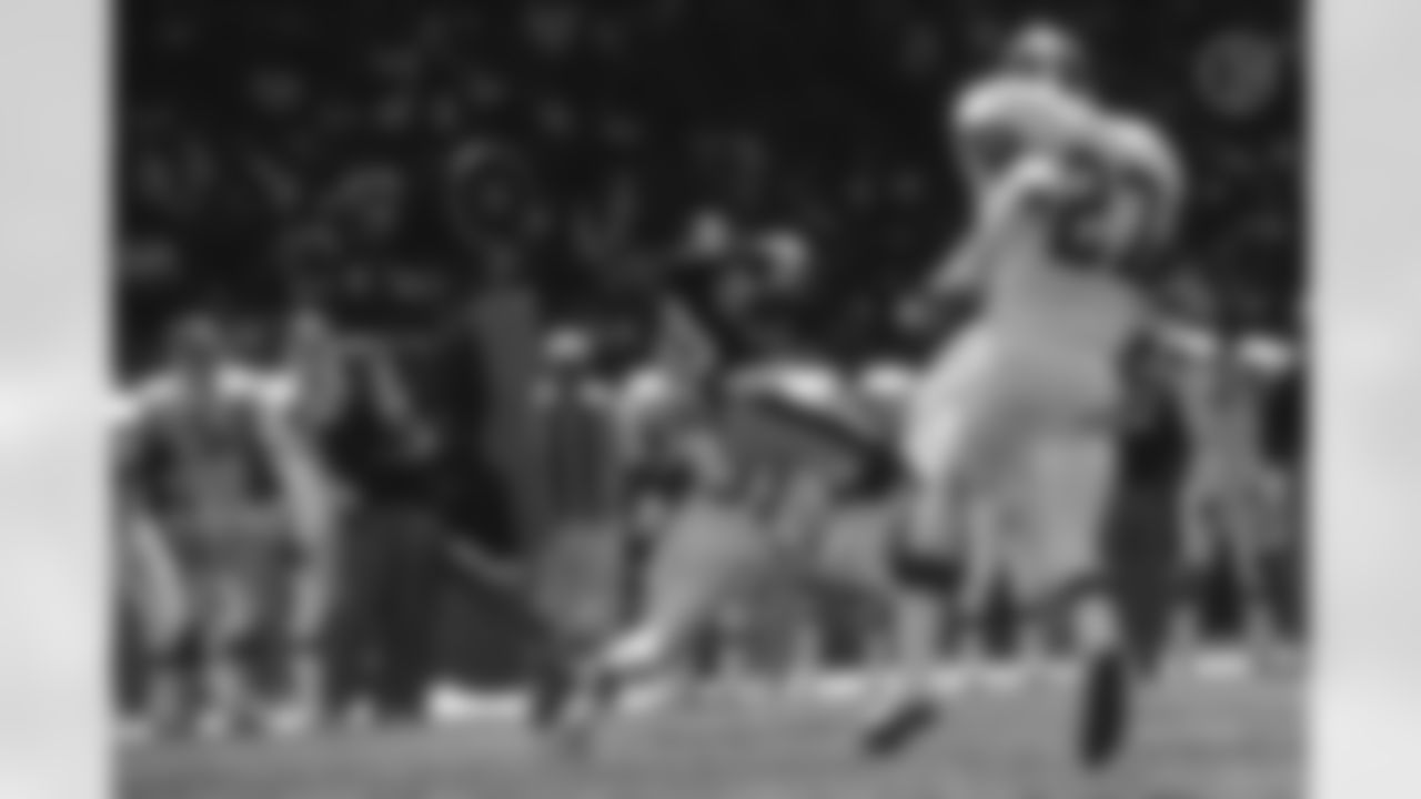 Action photograph of wide receiver Louis Lipps #83 during his time with the Steelers.