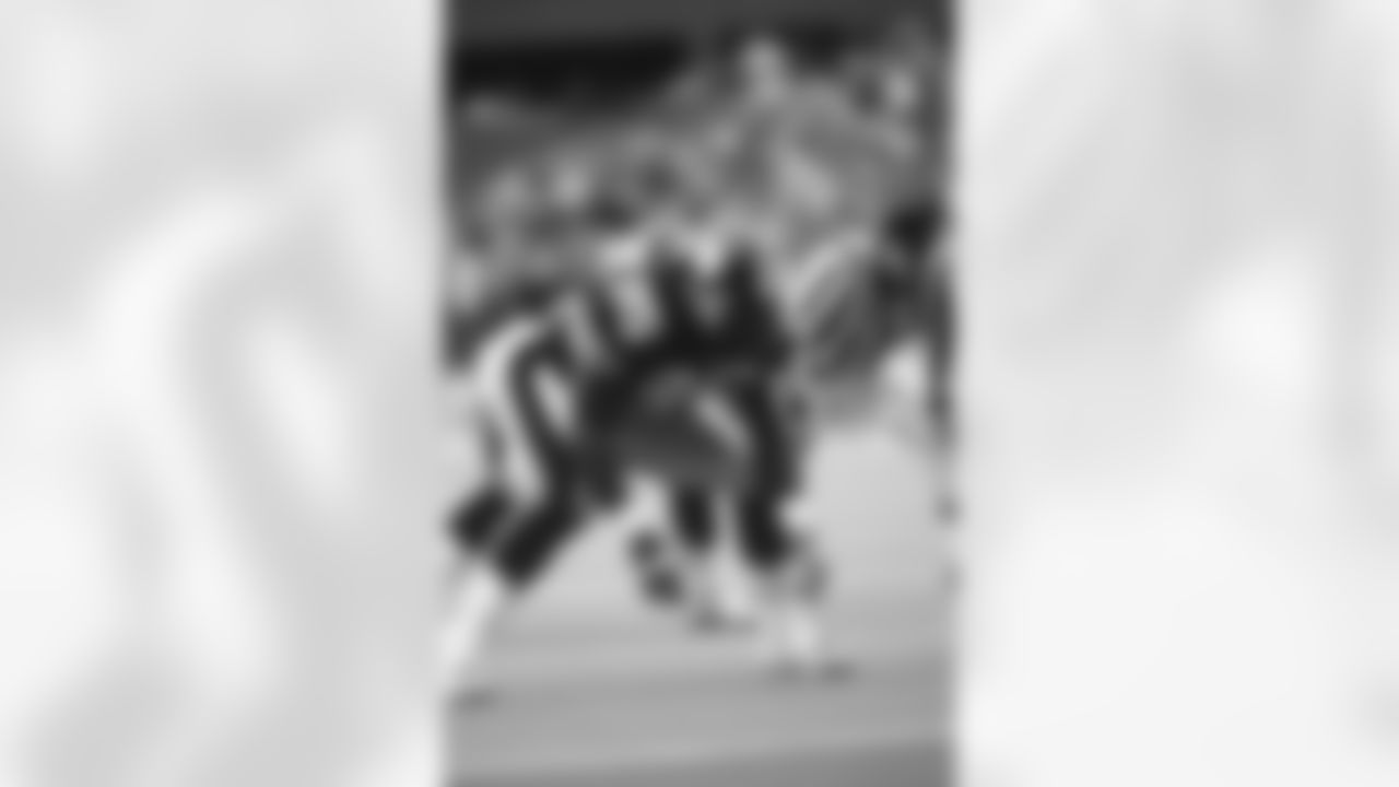 Action shot of linebacker Greg Lloyd #95 during his time with the Pittsburgh Steelers.