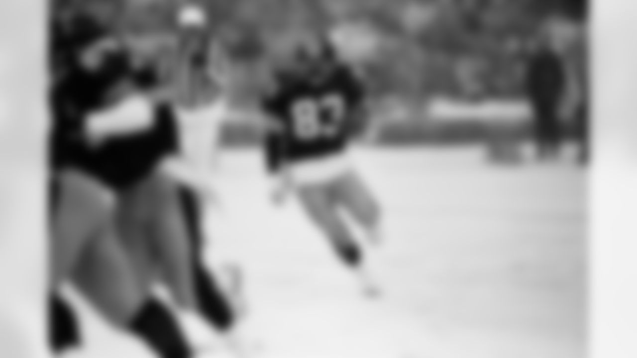 Action photograph of wide receiver Louis Lipps #83 during his time with the Steelers.