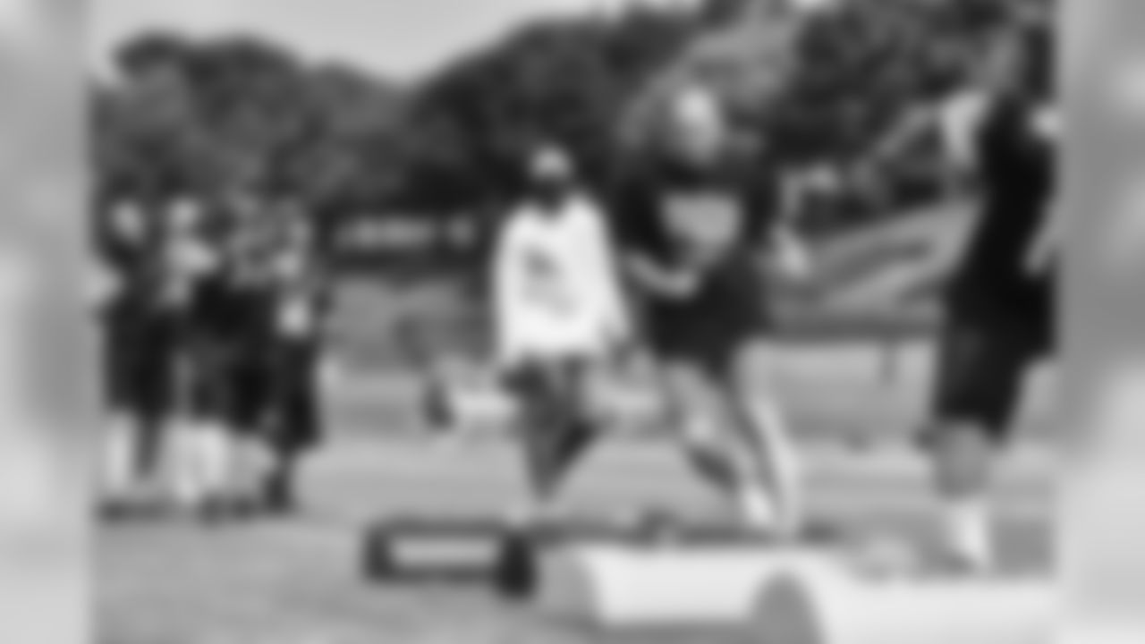 Steelers fans take part in on-field drills during Men's Fantasy Camp.