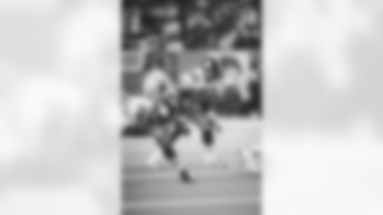 Action shot of linebacker Greg Lloyd #95 during his time with the Pittsburgh Steelers.