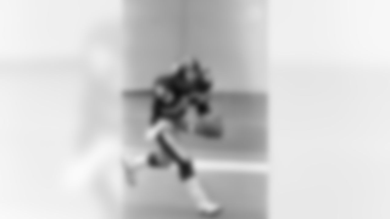 Action photograph of wide receiver Louis Lipps #83 during his time with the Steelers.