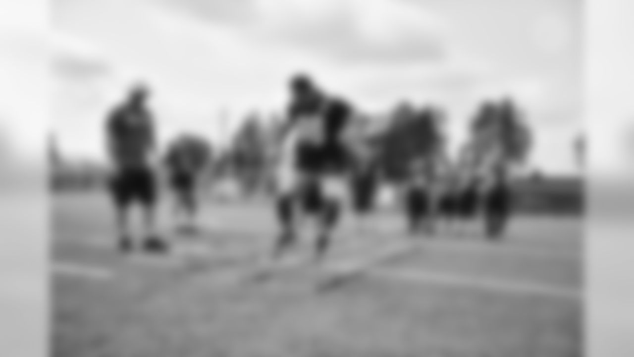 Steelers fans take part in on-field drills during Men's Fantasy Camp.