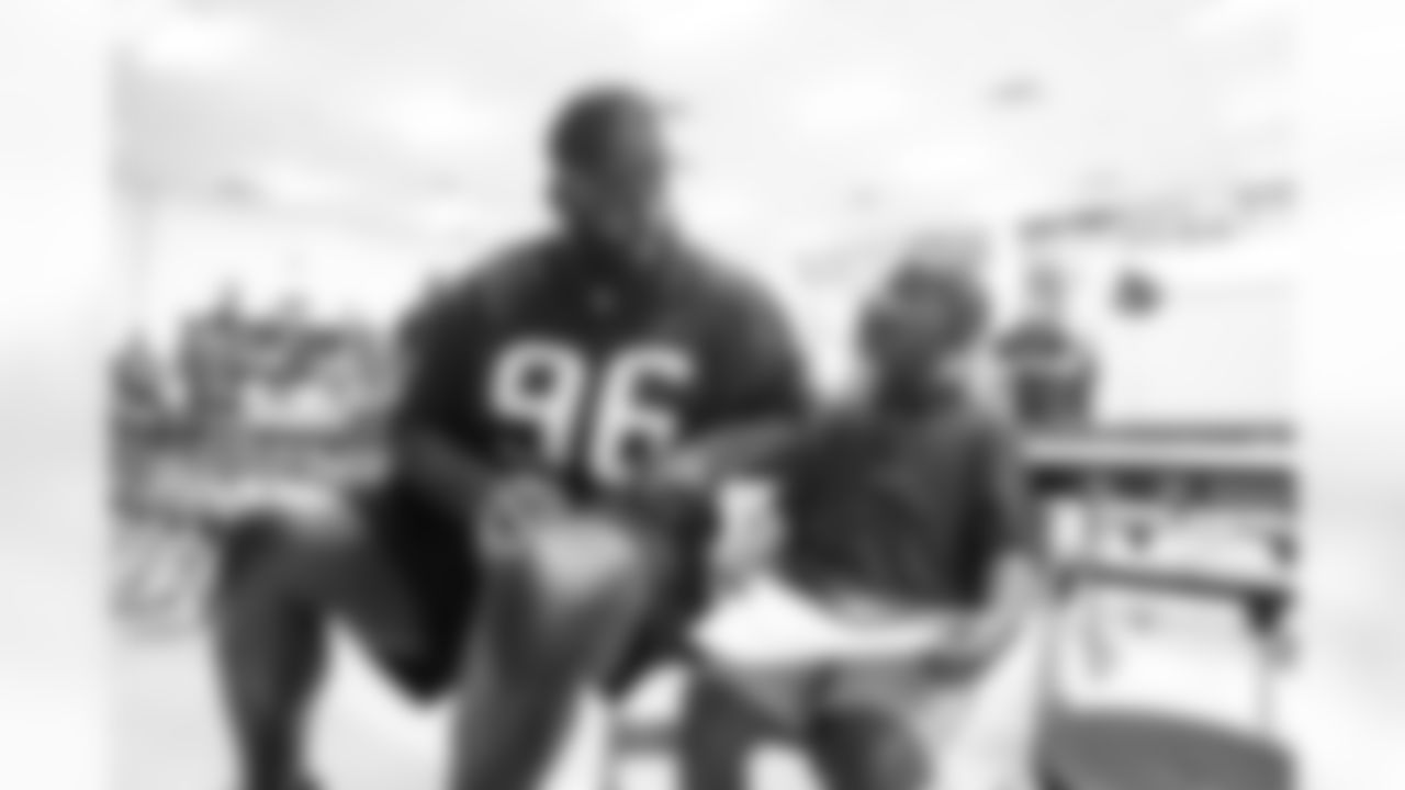 A September 12, 2023 image from the Texans Care CoolxDad picture day and Flag-in-Schools clinic at Blackshear Elementary School in Houston, TX.