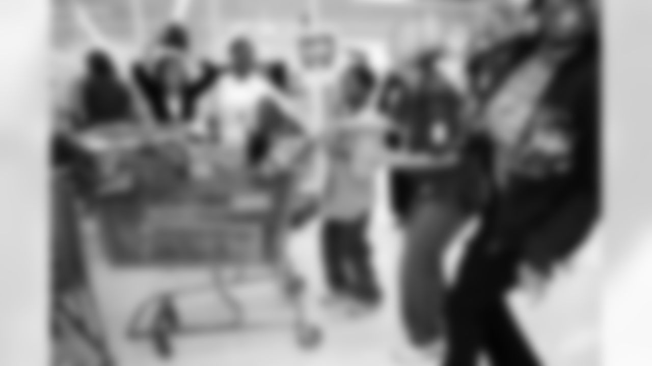With the 80 seconds up, a satisfied young shopper shares a smile with several adults.