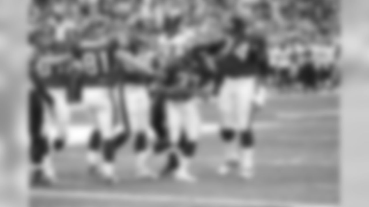 Walker congratulated by Salaam
