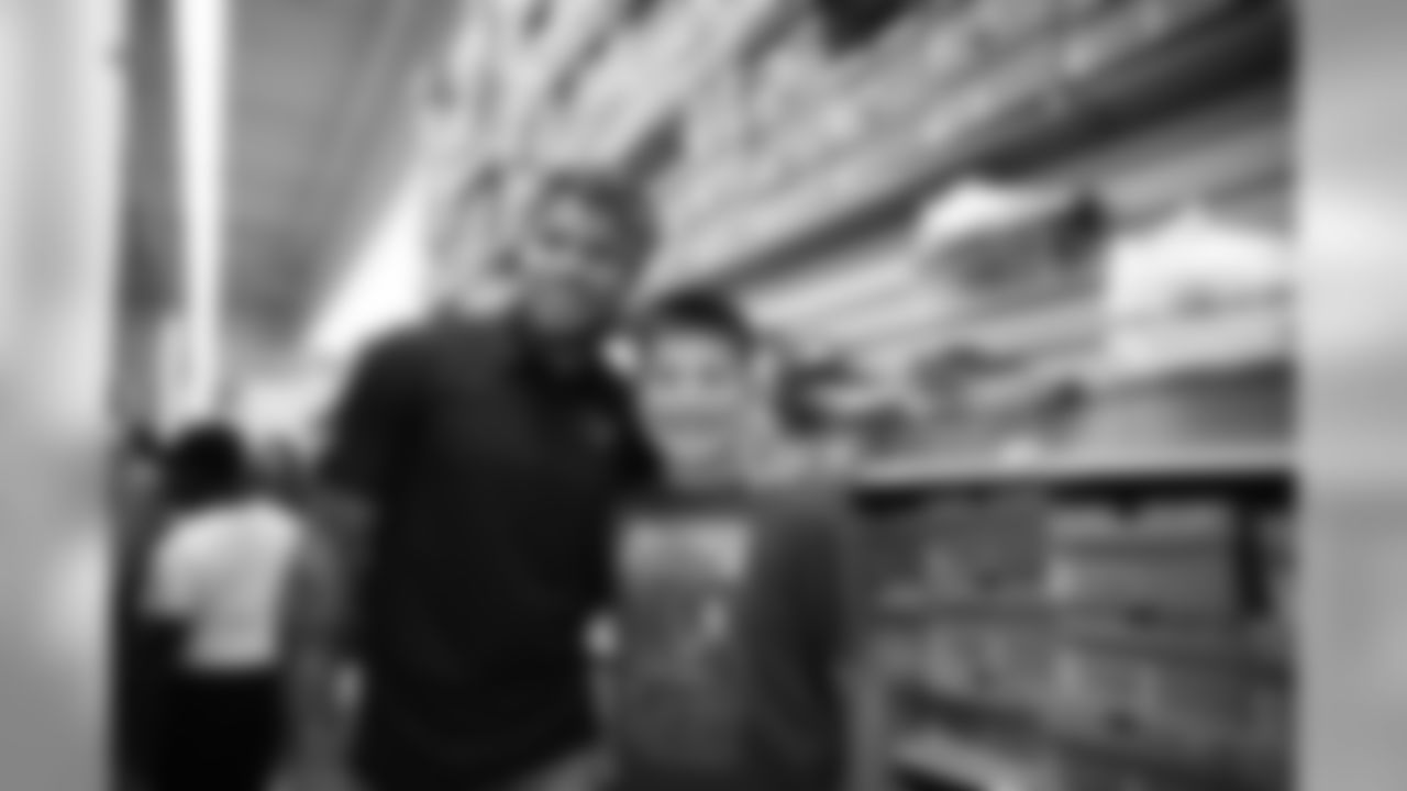 A July 23, 2018 photo from a community development event at Academy Sports and Outdoors in Humble, TX featuring Tyrann Mathieu.