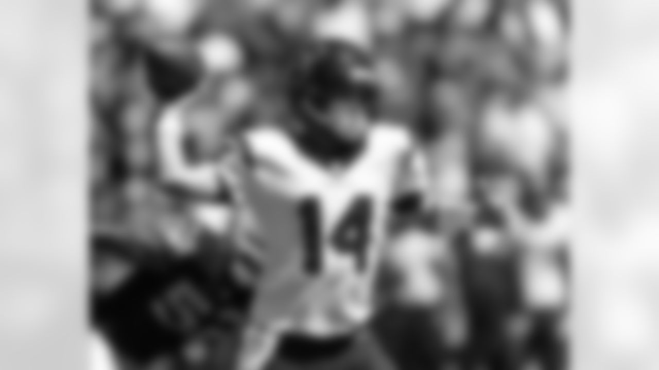 Houston Texans quarterback Ryan Fitzpatrick drops back to throw in the first quarter of an NFL football game against the Oakland Raiders, Sunday, Sept. 14, 2014, in Oakland, Calif. (AP Photo/Beck Diefenbach)