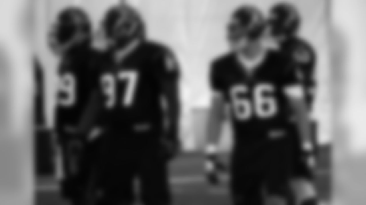 The defensive line gets ready for the play.