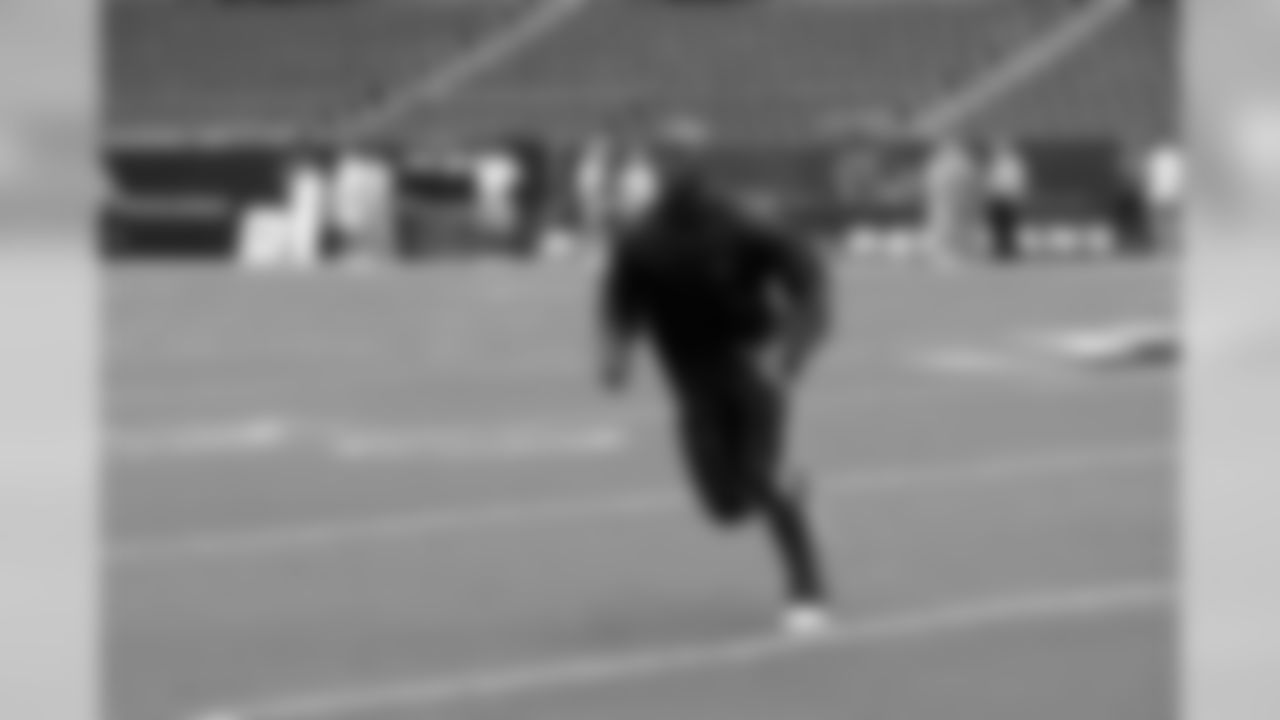Linebacker DeMeco Ryans runs during warm-ups.