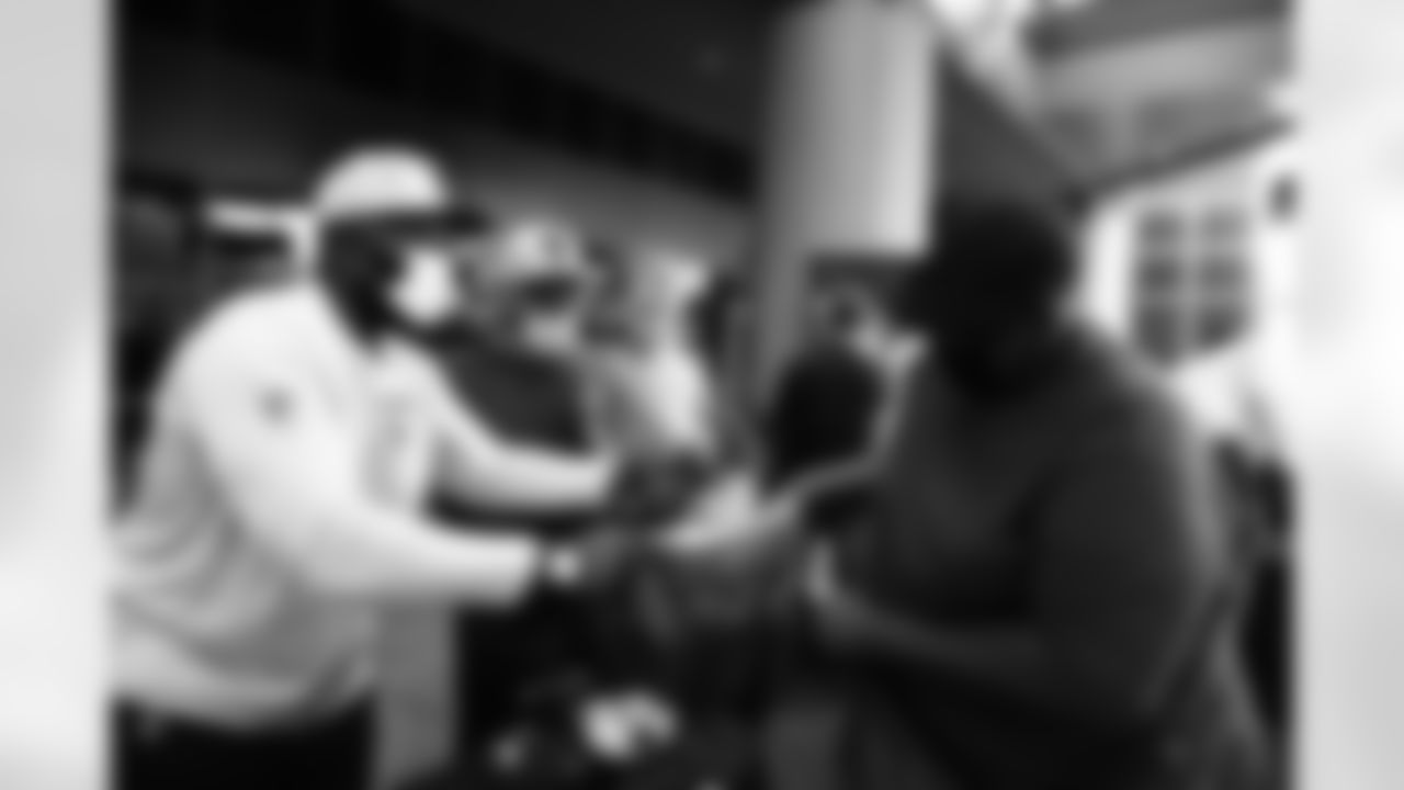 An image from the Nov. 22, 2021 Houston Texans Community Event in which the entire coaching and football staff handed out thanksgiving dinner and Texans gear at the Houston VA Hospital.